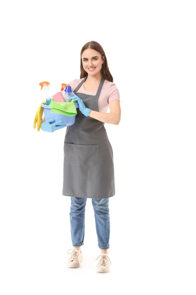 Female janitor with cleaning supplies on white background — Stock Photo, Image