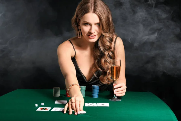 Female poker player at table in casino Royalty Free Stock Photos