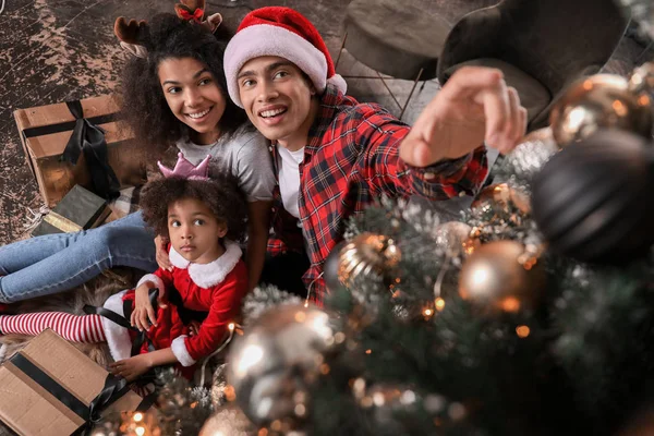 Happy African-American family at home on Christmas eve — Stock Photo, Image