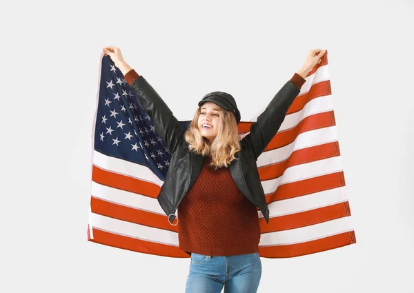 Young woman with USA flag on light background. Memorial Day celebration — Stock Photo, Image