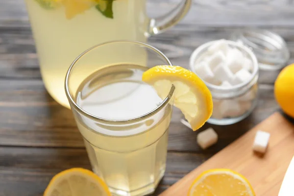 Glass of tasty lemonade on table — Stock Photo, Image