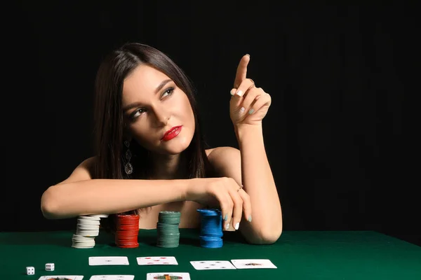 Female poker player at table in casino — Stock Photo, Image