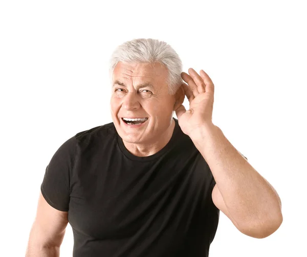 Mature man with hearing problem on white background — Stock Photo, Image