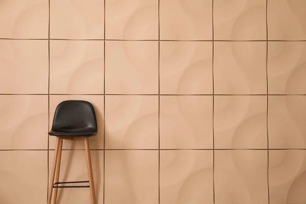 Stylish chair near light wall — Stock Photo, Image