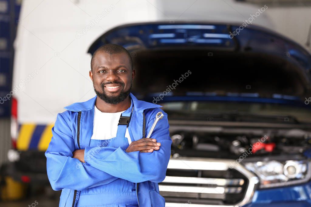 African-American mechanic in car service center