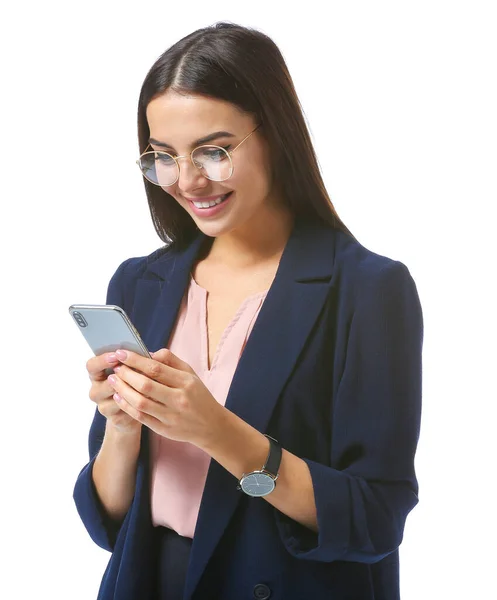 Beautiful young businesswoman with mobile phone on white background — Stock Photo, Image