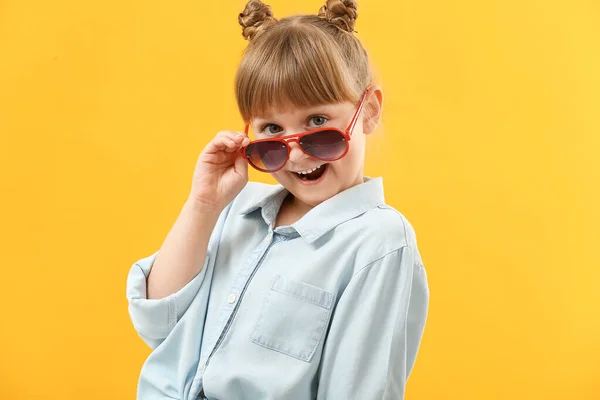 Portrait of stylish little girl on color background — Stock Photo, Image