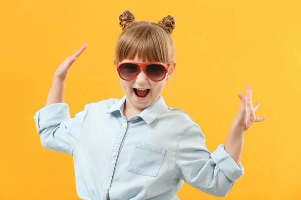 Portrait of stylish little girl on color background — Stock Photo, Image