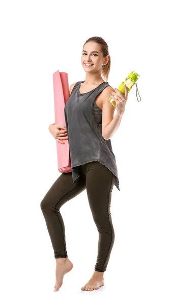 Beautiful young woman with yoga mat and bottle of water on white background — Stock Photo, Image