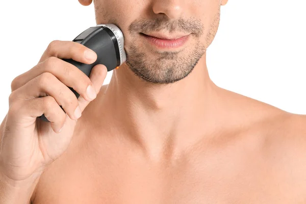 Handsome young man shaving on white background, closeup — Stock Photo, Image