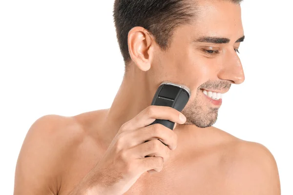 Handsome young man shaving on white background — Stock Photo, Image