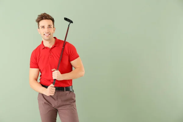 Handsome male golfer on color background — Stock Photo, Image