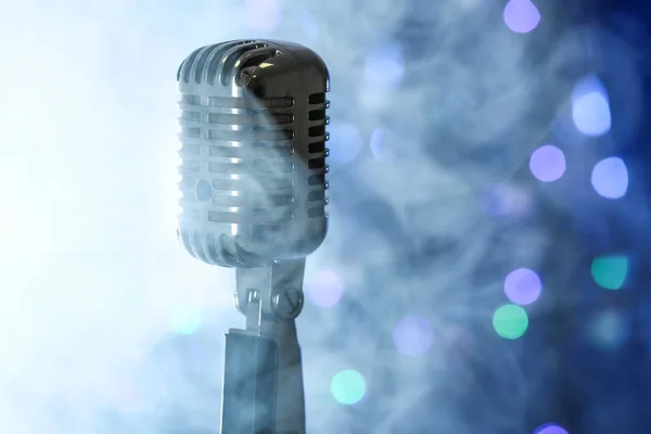 Retro microphone with smoke against defocused lights — Stock Photo, Image