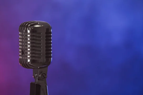 Retro microphone on dark color background with smoke — Stock Photo, Image
