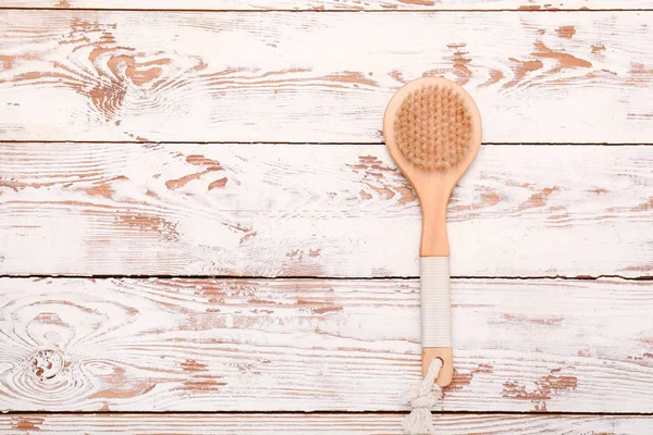 Brush for bath on wooden background — Stock Photo, Image