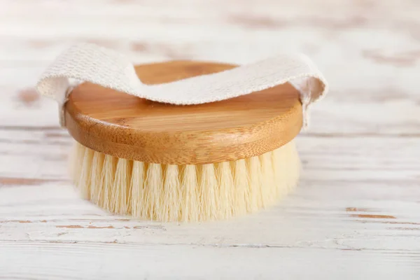 Brush for bath on wooden background — Stock Photo, Image