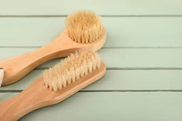 Brushes for bath on wooden background — Stock Photo, Image