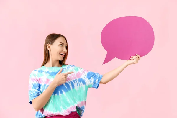 Beautiful young woman with blank speech bubble on color background — Stock Photo, Image