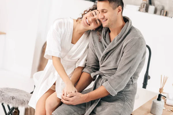 Happy young couple in bathroom at home — Stock Photo, Image