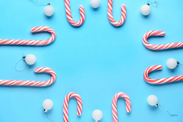 Beautiful Christmas composition with candy canes on color background — Stock Photo, Image