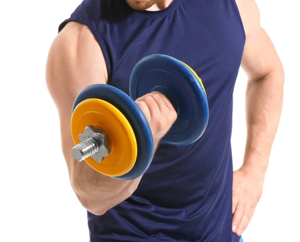 Sporty young man with dumbbell on white background — Stok fotoğraf