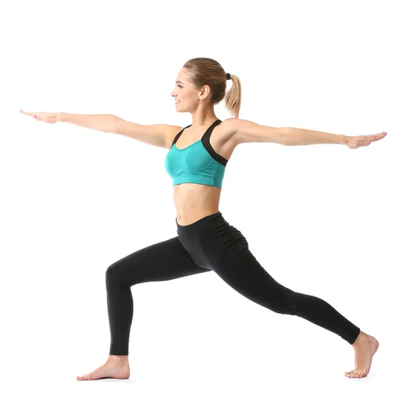 Schöne junge Frau praktiziert Yoga auf weißem Hintergrund — Stockfoto