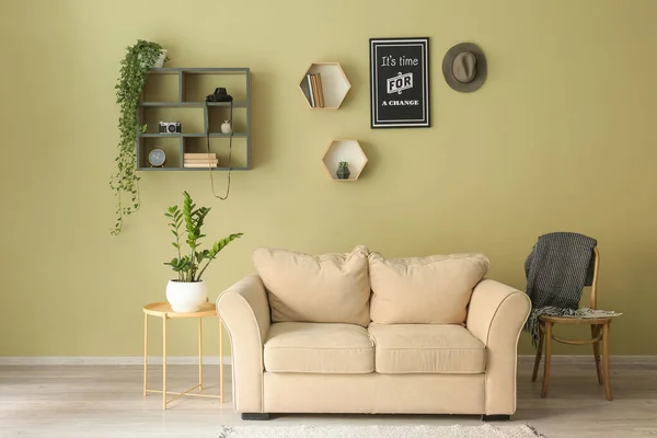 Interior of room with modern sofa, table and shelves — Stock Photo, Image