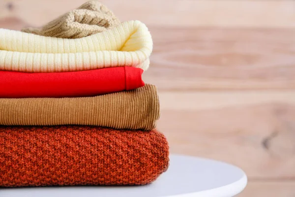 Set of warm winter clothes on table — Stock Photo, Image