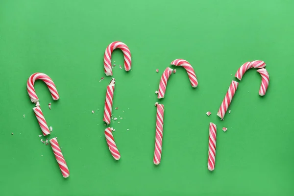 Broken candy canes on color background — Stock Photo, Image