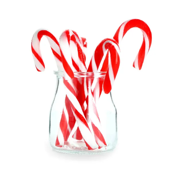 Glass jar with Christmas candy canes on white background — Stock Photo, Image