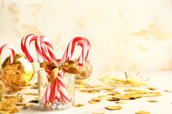 Composition with Christmas candy canes and decor on table — Stock Photo, Image