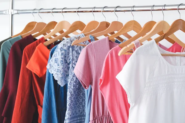 Rack with clothes in modern dry-cleaner's — Stock Photo, Image