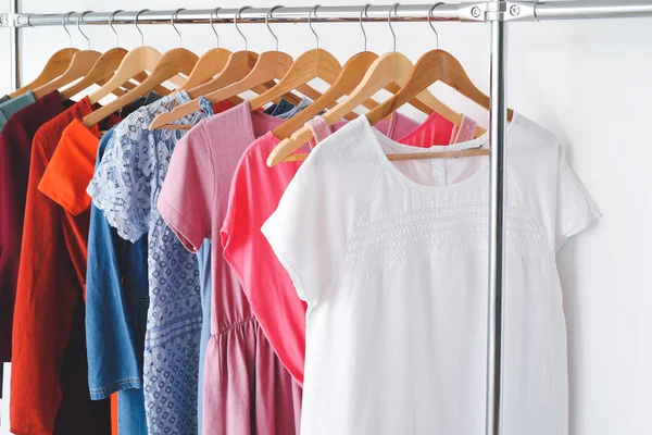 Rack with clothes in modern dry-cleaner's — Stock Photo, Image