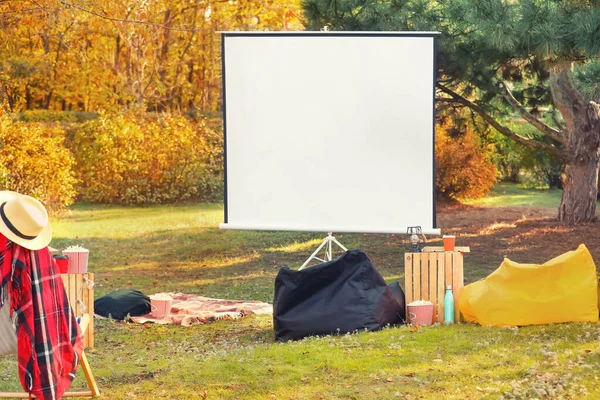 Outdoor cinema in autumn park