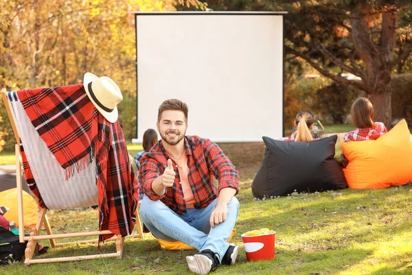 Young man in outdoor cinema — Stock Photo, Image