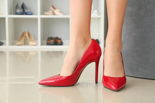 Young woman in elegant high-heels in dressing room — Stock Photo, Image