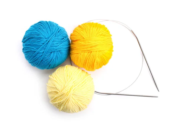 Knitting yarns and needles on white background — Stock Photo, Image