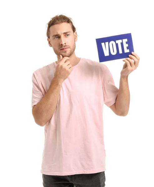 Thoughtful man holding paper with text VOTE on white background — Stock Photo, Image