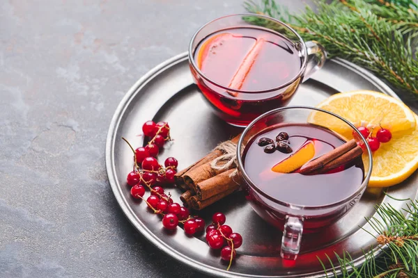 Cups of tasty mulled wine on table — Stock Photo, Image
