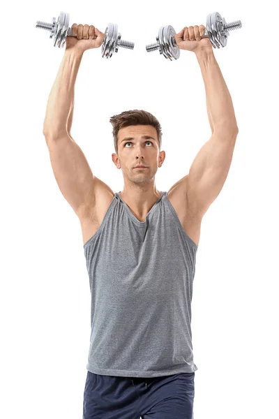 Sporty young man with dumbbells on white background — Stock Photo, Image