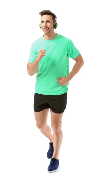 Sporty running young man on white background — Stock Photo, Image