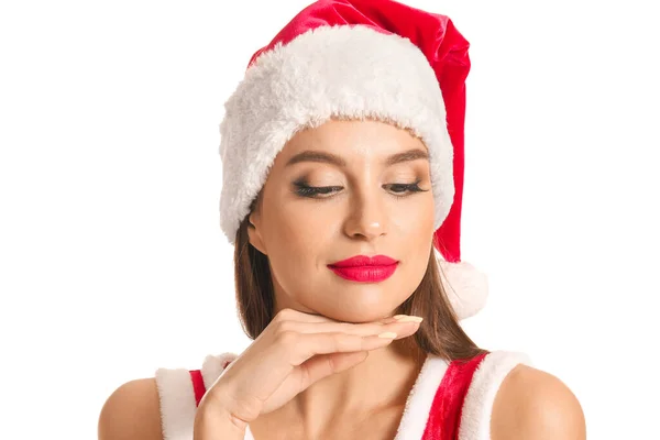 Schöne junge Frau im Weihnachtsmannkostüm auf weißem Hintergrund — Stockfoto