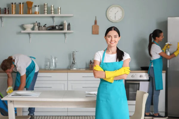 Team of janitors cleaning kitchen — Stock Photo, Image