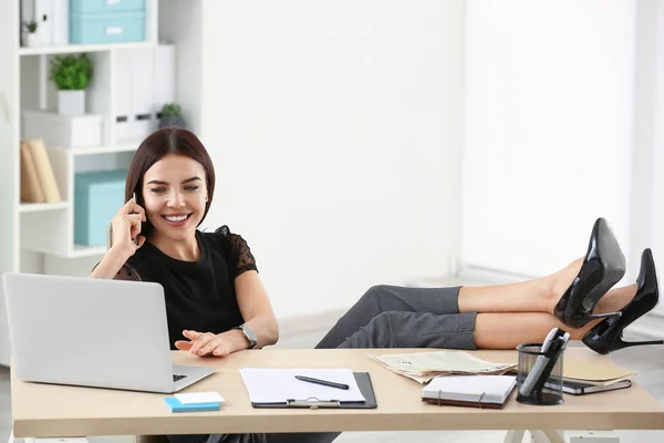 Beautiful young businesswoman working in office — Stock Photo, Image