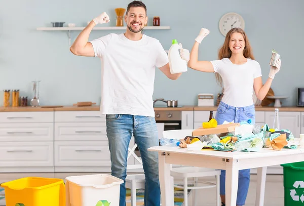 Couple sorting garbage at home. Concept of recycling — Stock Photo, Image