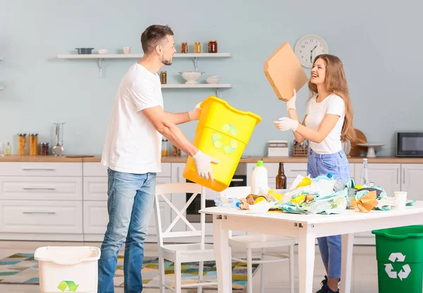 Couple sorting garbage at home. Concept of recycling — Stock Photo, Image