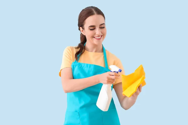 Female janitor on color background — Stock Photo, Image