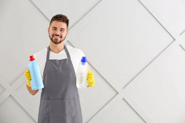 Male janitor on grey background — Stock Photo, Image