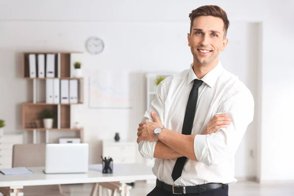 Handsome young businessman in modern office — Stock Photo, Image