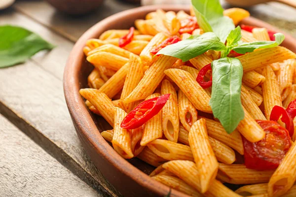 Plate with tasty pasta on wooden table, closeup — Stock Photo, Image